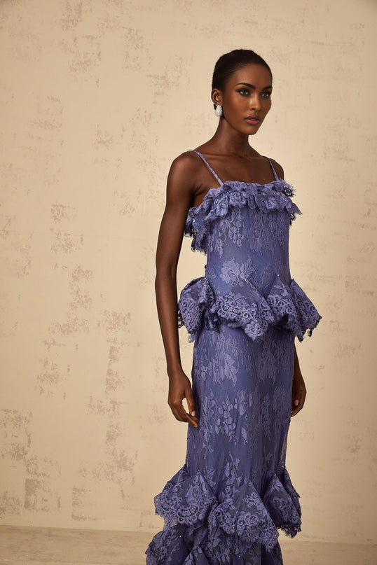 A purple maxi dress with floral lace pattern and ruffled details named Heloise