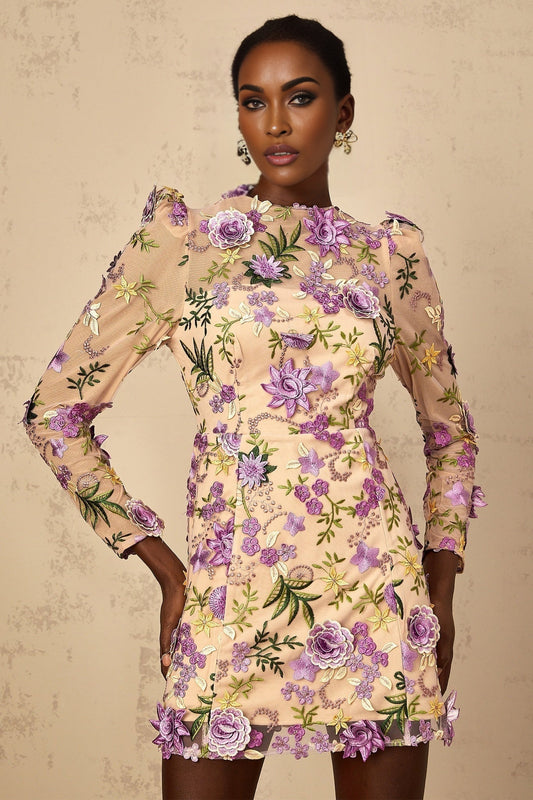 A purple mini dress with floral applique and embroidered tulle featuring a delicate floral pattern on a sheer overlay