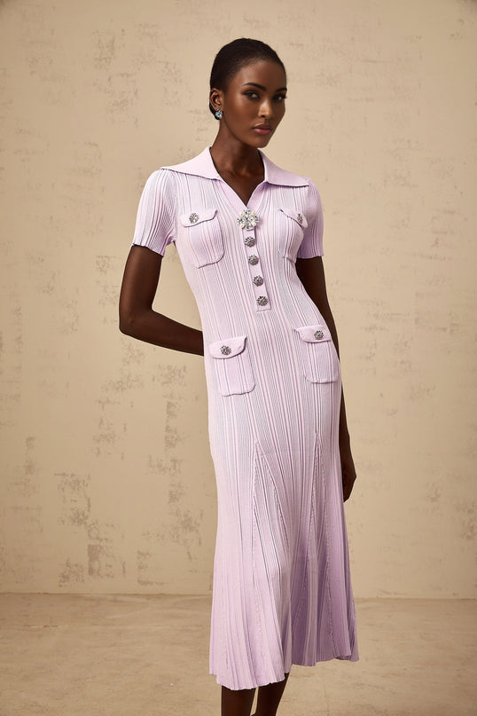 A purple ribbed knit midi dress with a flared hem and fitted silhouette named Celeste