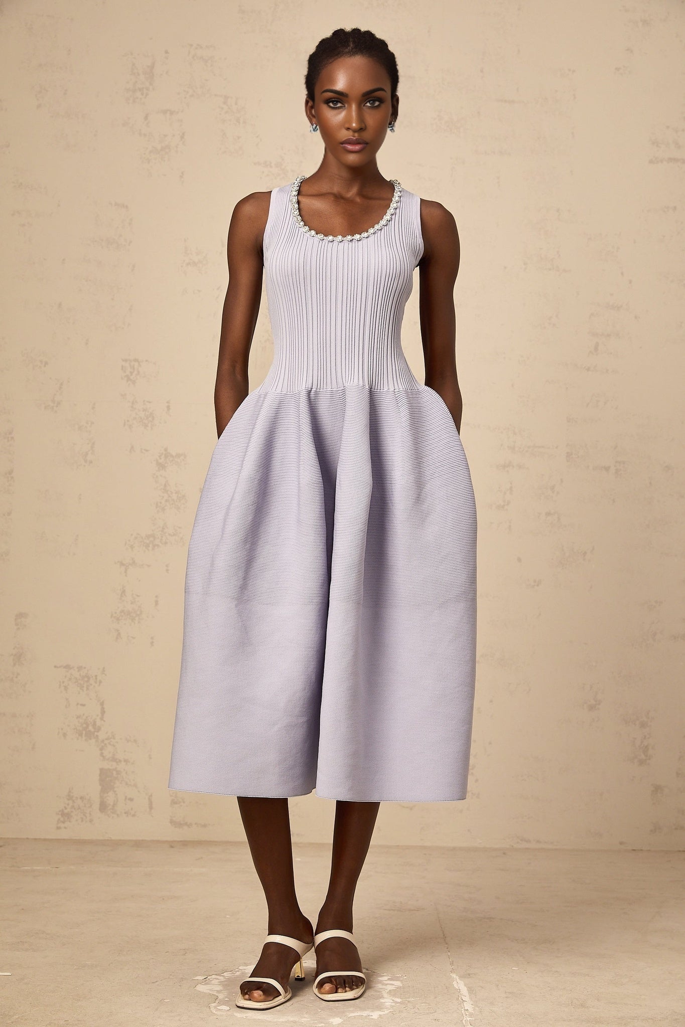 A purple ribbed knit midi dress with embellishments featuring a fitted silhouette and long sleeves