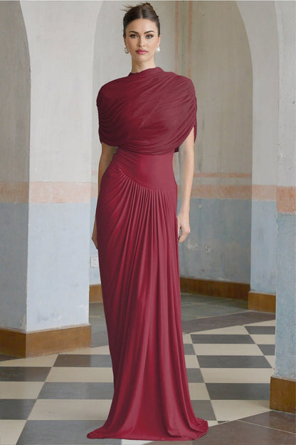 A red asymmetric maxi dress with pleated details and a long flowing skirt