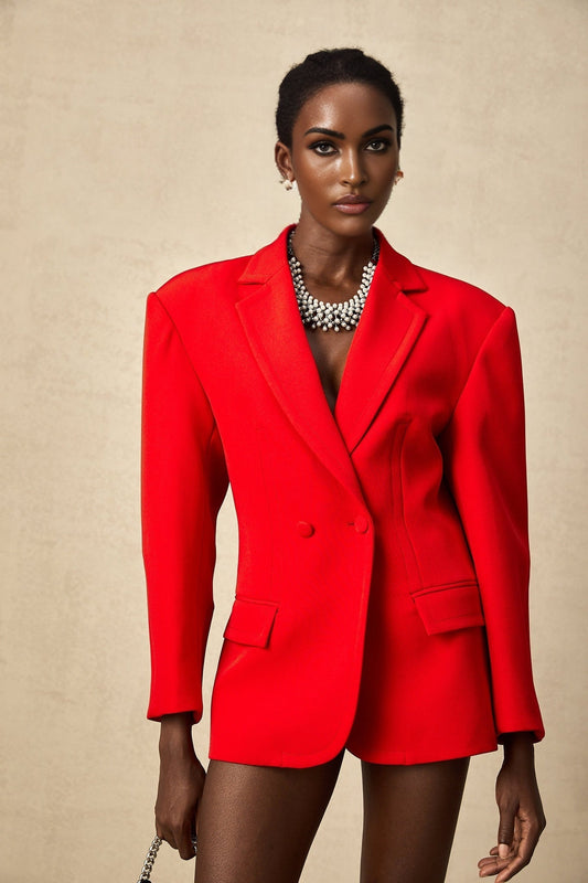 A red blazer with hourglass silhouette and doublebreasted design