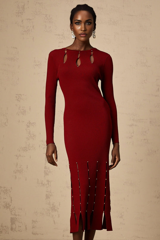 A red knit midi dress with long sleeves and beaded details featuring cutout sections and a form fitting silhouette