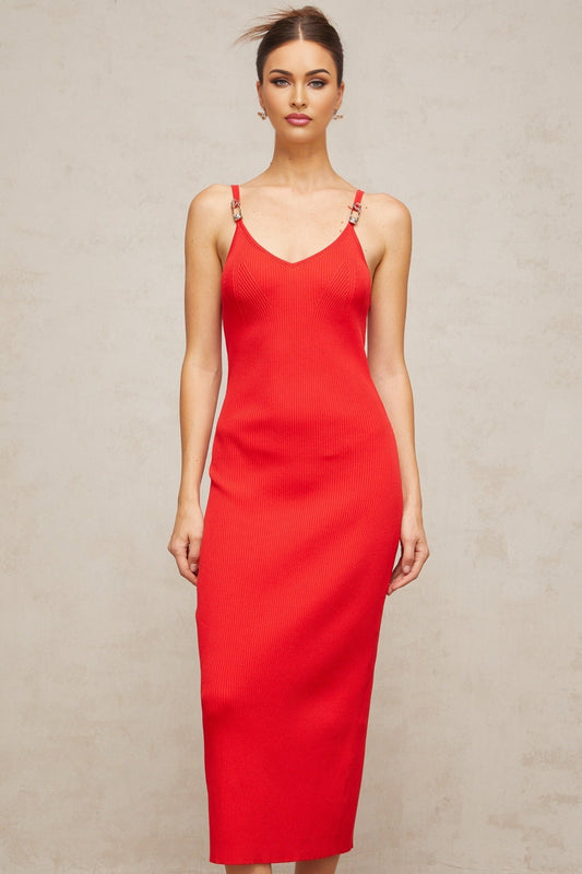A red knitted midi dress with pin details featuring a fitted silhouette and long sleeves