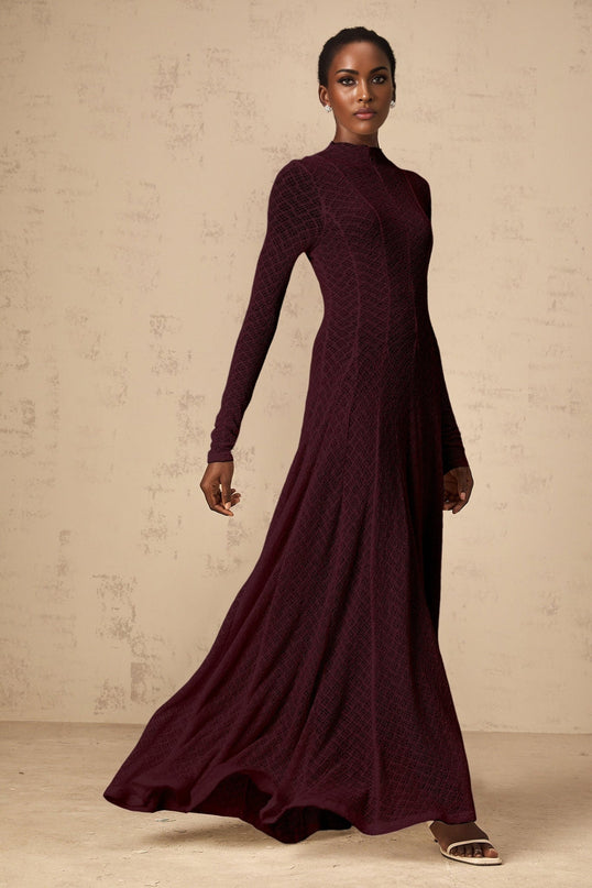 A red lace maxi dress with a wavy pattern design called Athena