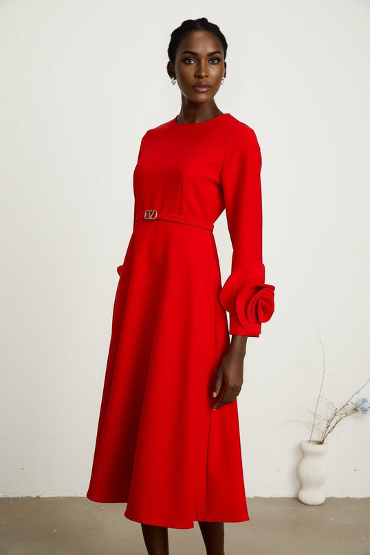 A red long sleeve dress with floral pattern featuring Aurelia design