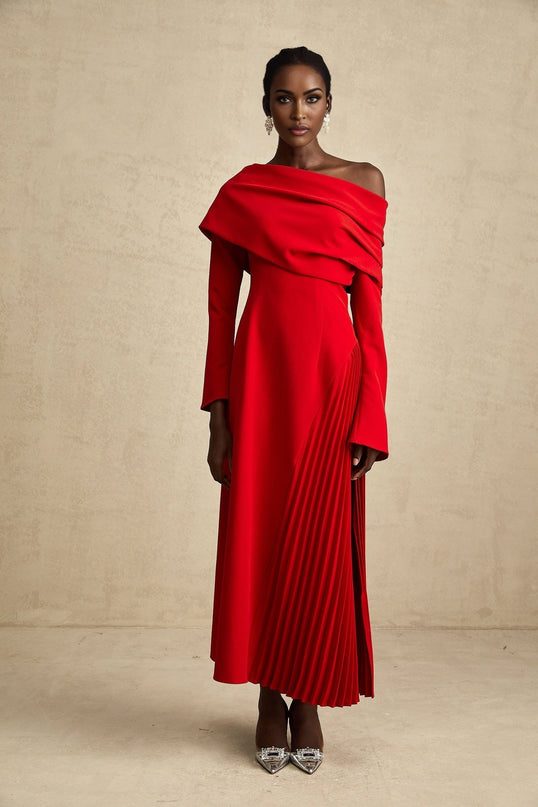 A red maxi dress with a high slit and pleated design perfect for Valentines Day