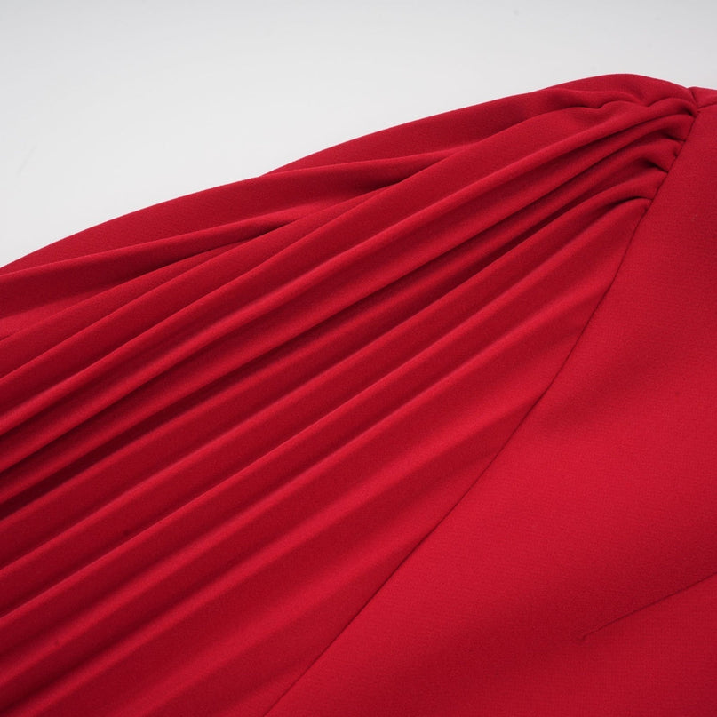 A red maxi dress with a high slit and pleated design suitable for Valentines Day celebrations