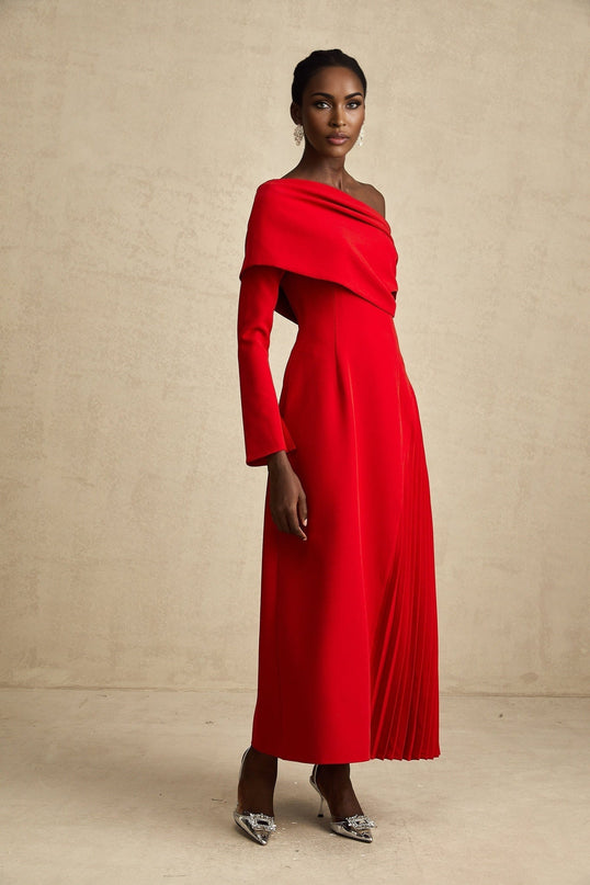 A red maxi dress with a high slit and pleated design suitable for Valentines Day featuring a long flowing skirt and romantic style