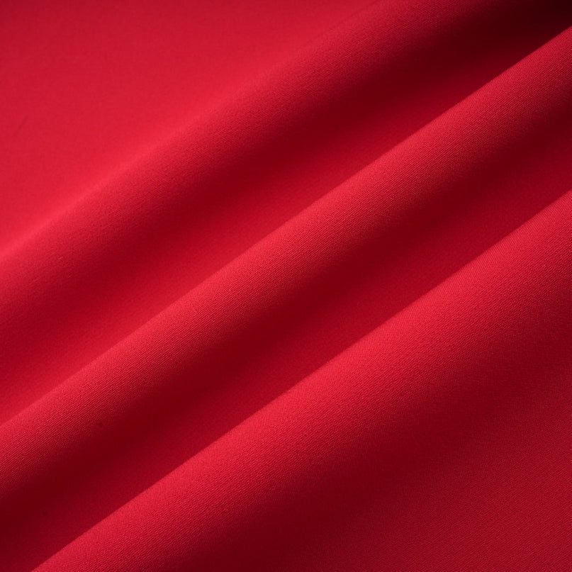 A red maxi dress with a high slit and pleated design suitable for Valentines Day occasion