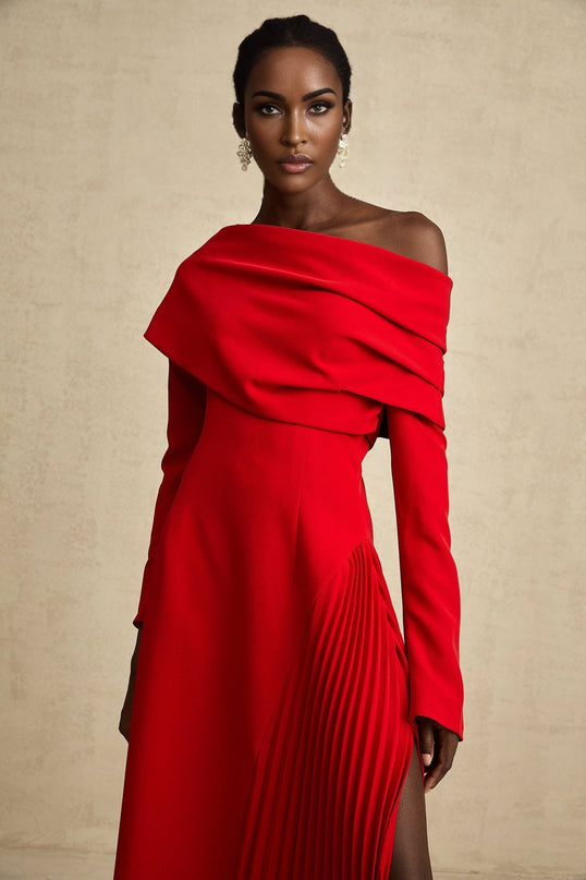 A red maxi dress with a high slit and pleated design suitable for Valentines Day occasions