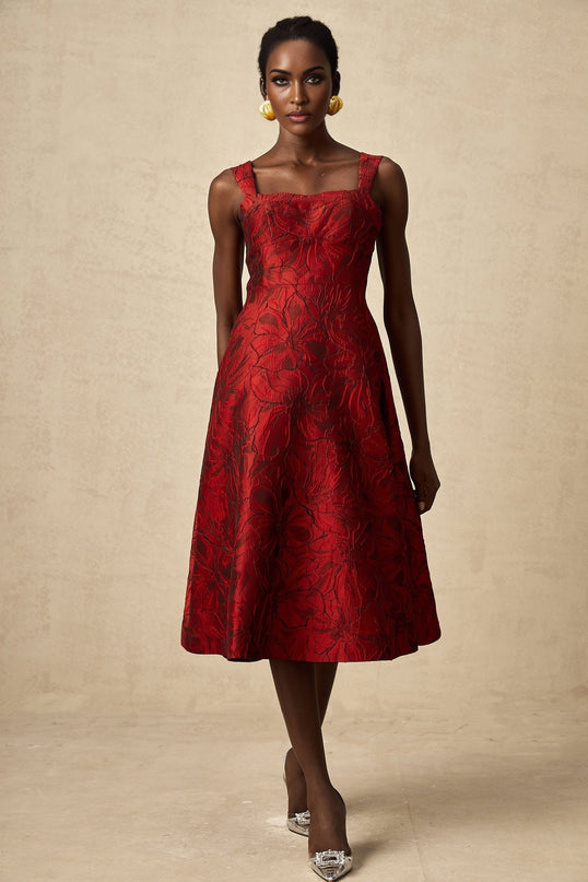 A red midi dress with a floral jacquard pattern featuring a fitted silhouette and feminine design
