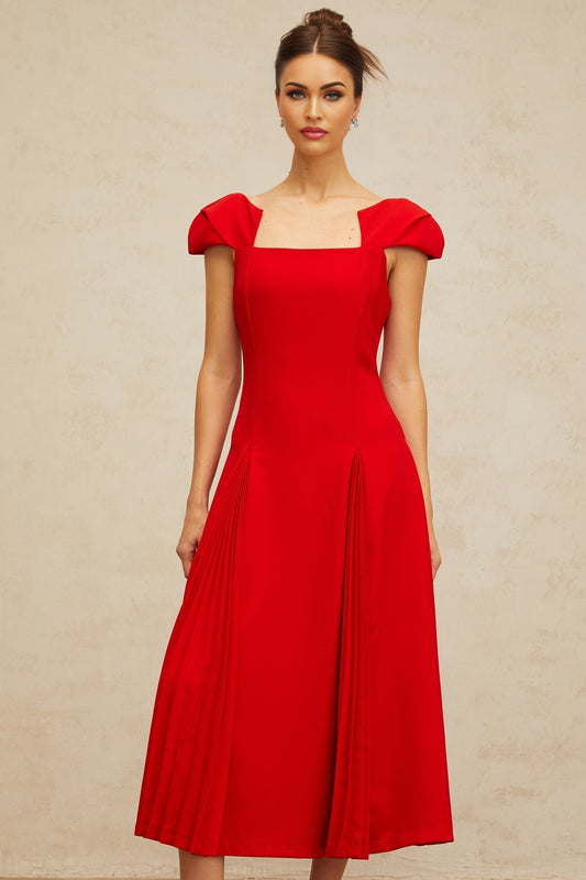A red midi dress with pleated details and a flared skirt featuring long sleeves and a feminine silhouette