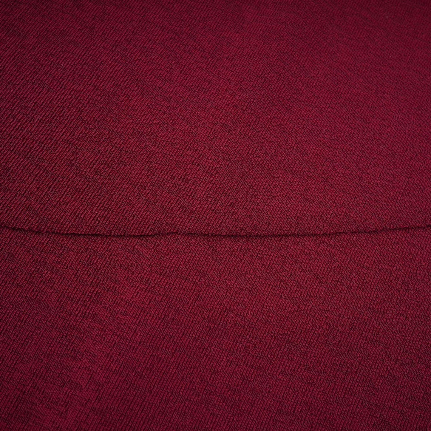 A red midi dress with ruched detailing and a flap design named Camille