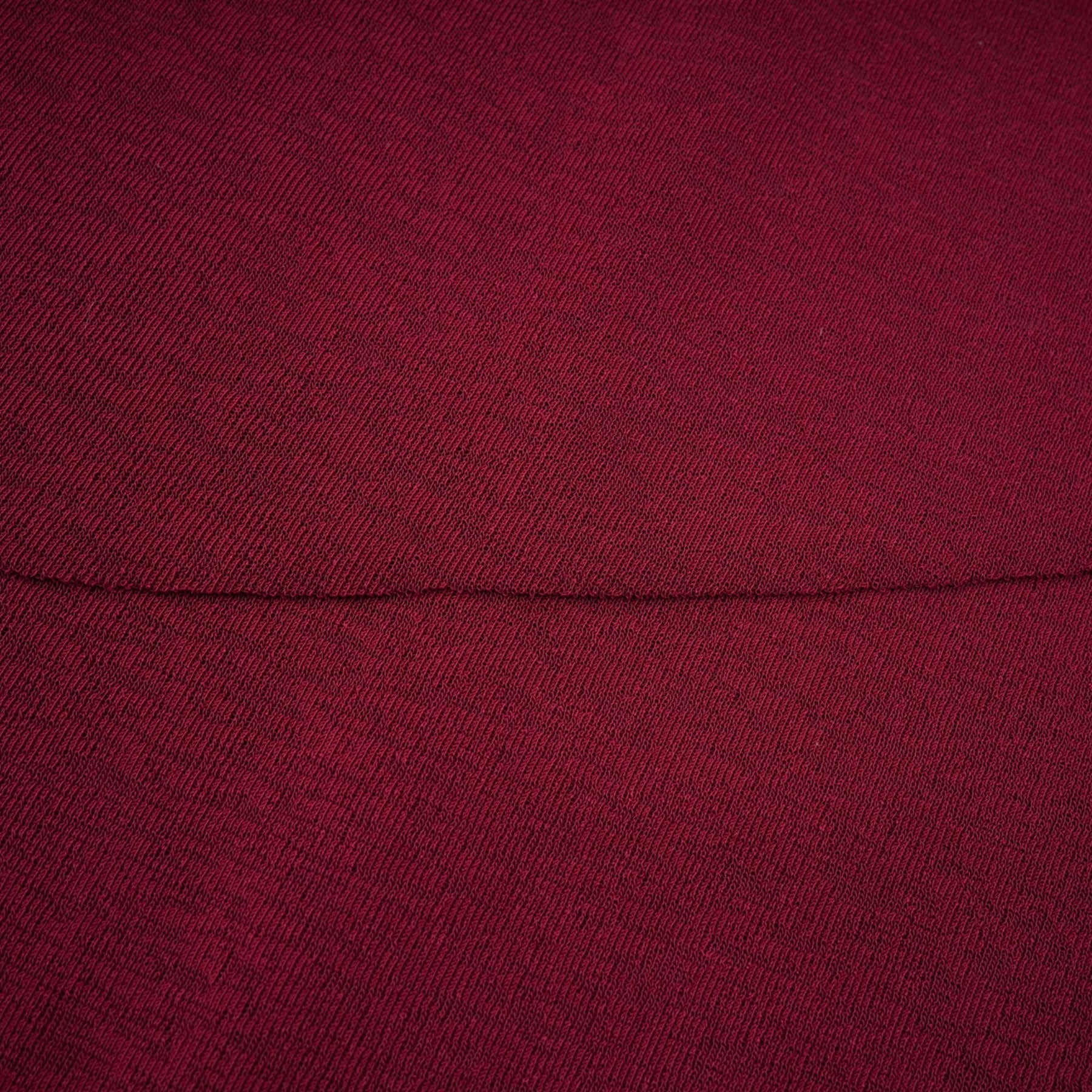 A red midi dress with ruched detailing and a flap design named Camille