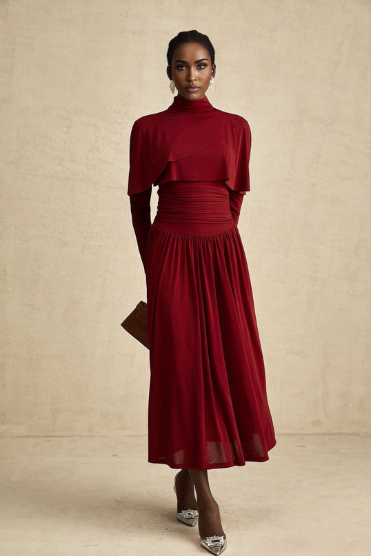 A red midi dress with ruched detailing and a flap design named Camille