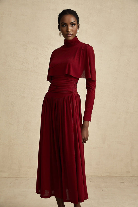A red midi dress with ruched detailing and a flap design named Camille