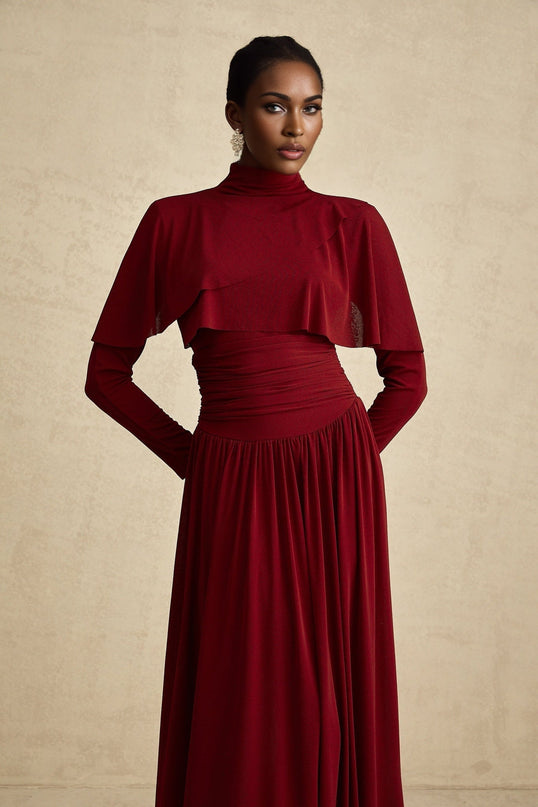 A red midi dress with ruched detailing and a flap design named Camille