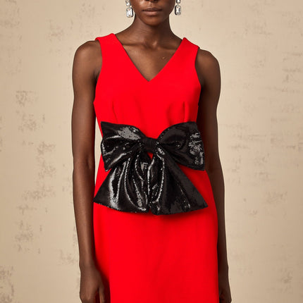 A red mini dress with a Vneckline featuring a sequin bow detail