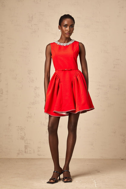 A red mini dress with pleated details and embellishments named Leonie