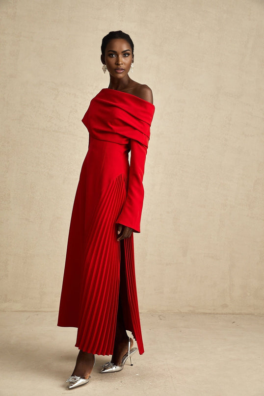A red pleated maxi dress with a high slit for Valentines Day featuring a flowing long skirt and romantic design