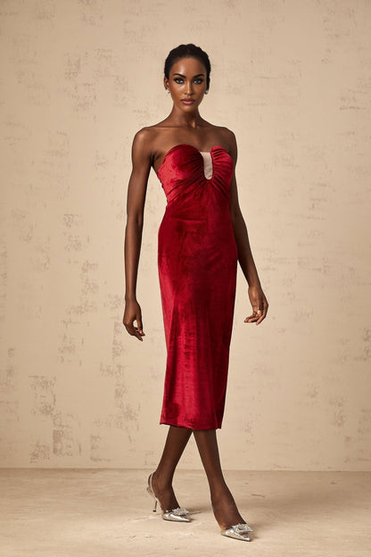 A red velvet midi dress with gathered details named Tiphaine featuring a flowing silhouette and luxurious fabric texture