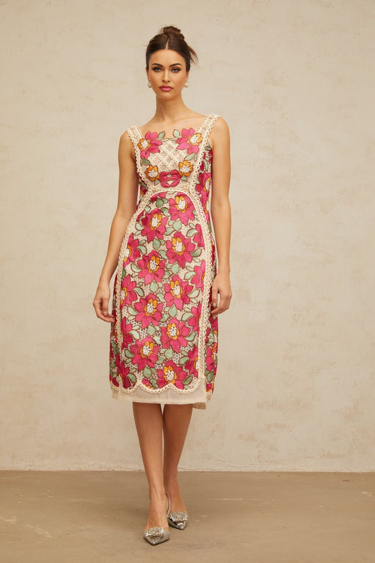 A rosepink midi dress with braided details and floral embroidery featuring a fitted silhouette and delicate design elements