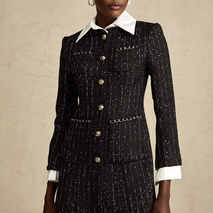 A short black dress featuring a combination of tweed fabric and sequin panels with a mini length silhouette and likely sleeveless design named Audrey