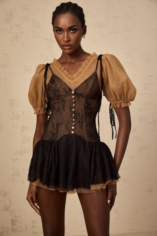 A short black mini dress with lace panels featuring a fitted silhouette and delicate feminine design