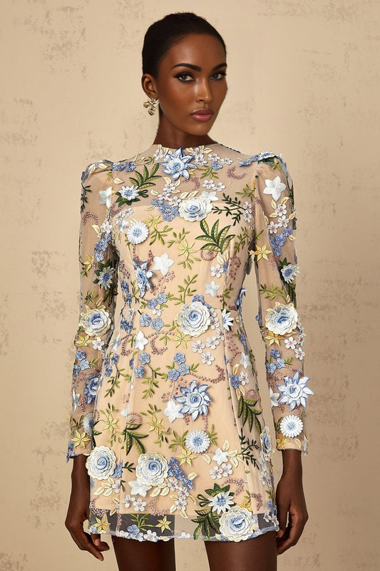 A short blue dress with floral applique and embroidery on tulle fabric featuring a mini length and delicate floral designs