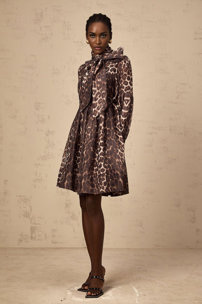 A short brown leopard print mini dress with a large bowknot detail and xylene inspired design