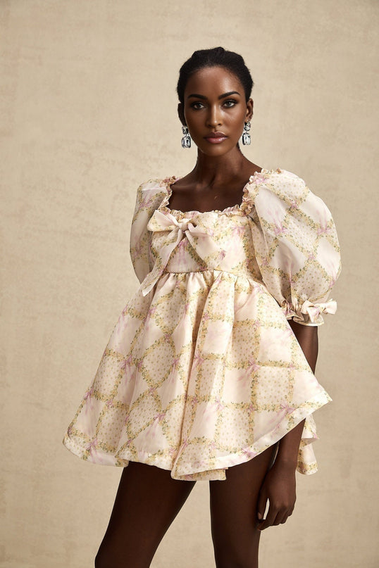 A short checkered mini dress with a puffy skirt and a large bow accent