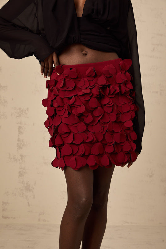 A short flared mini skirt with threedimensional petallike details creating a textured Aline silhouette