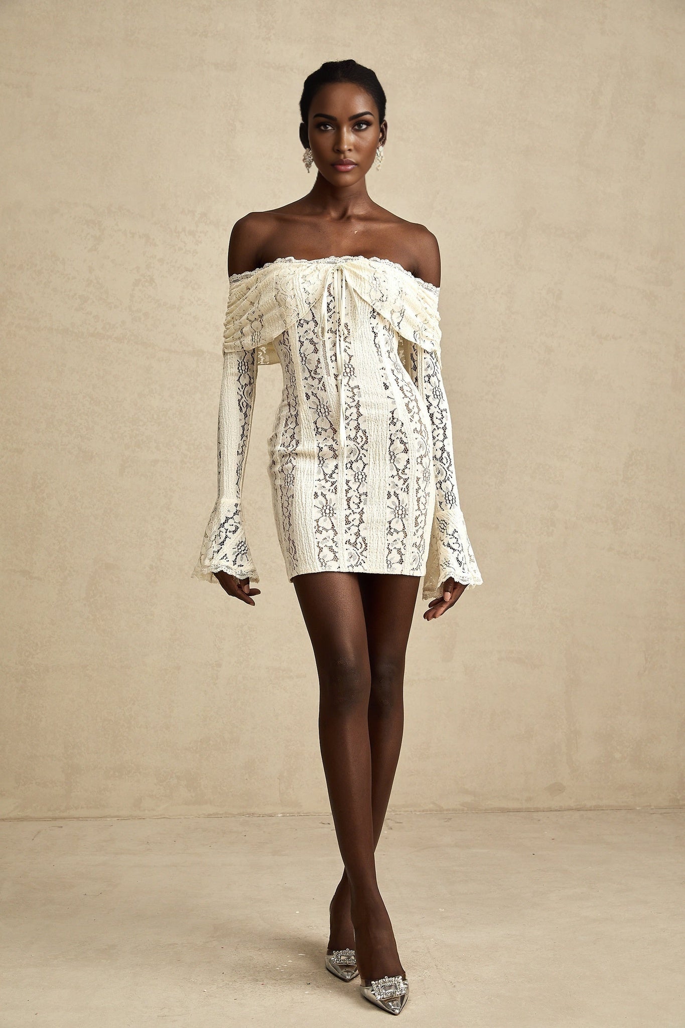 A short floral lace mini dress in neutral tones with flared cuffs named Émeline