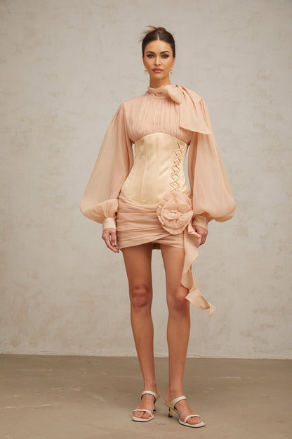 A short floral mini dress with cinched waist and applique details featuring paneled construction in light colors
