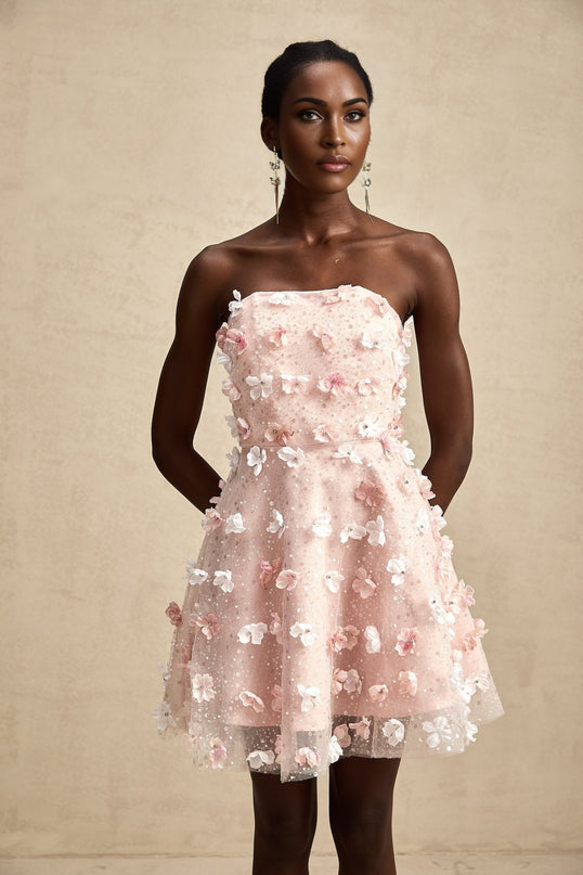 A short floral mini dress with threedimensional puffy petals covering the fabric creating a textured and voluminous appearance