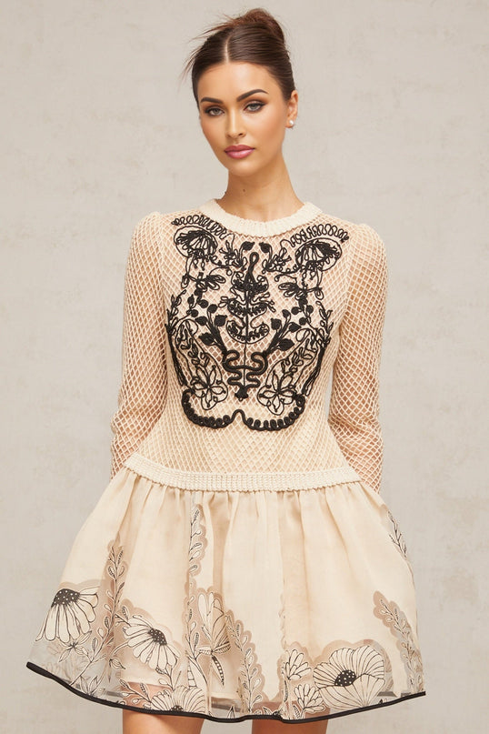 A short floral patterned mini dress with contrasting color floral appliques on a jacquard fabric featuring a design named Wilhelmine