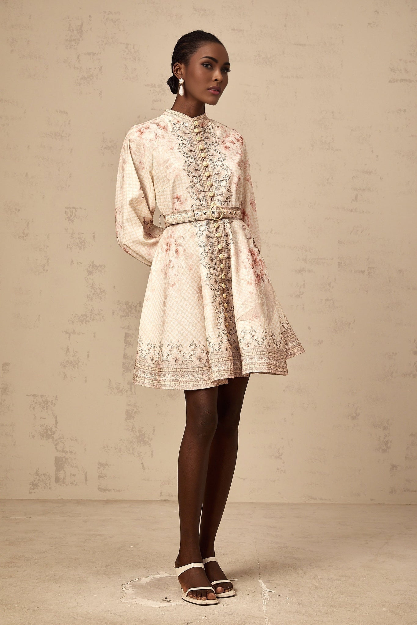 A short floral print mini dress with a belted waist featuring the Quincia design