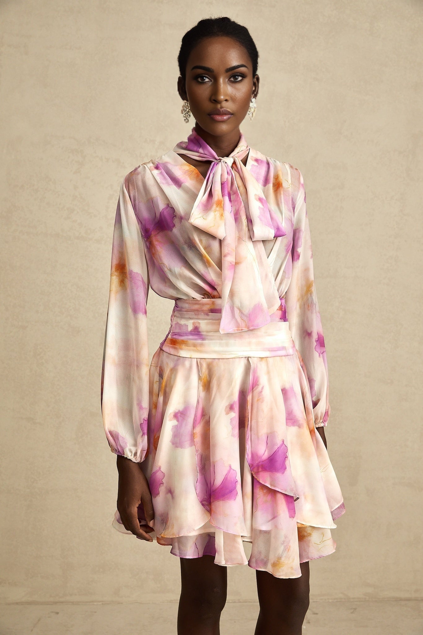 A short floral print mini dress with a V neckline in the Maelys style