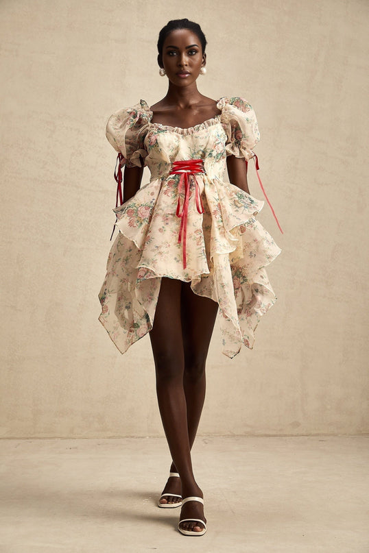 A short floral print mini dress with layers of tulle fabric and tie up details named Salome