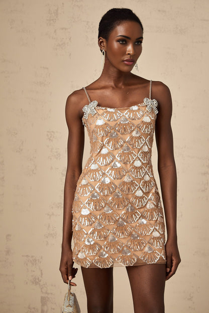 A short glittering mini dress with sequin embellishments reflecting light