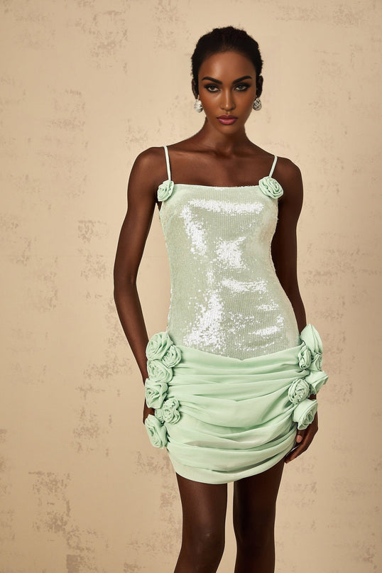 A short green mini dress with floral pattern and sequin embellishments called Elise