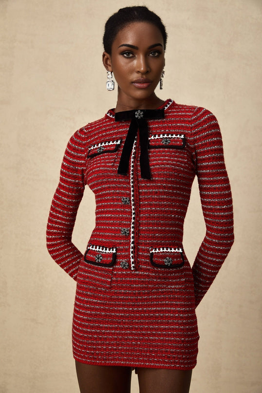 A short knit mini dress with a bow detail likely named Faustine