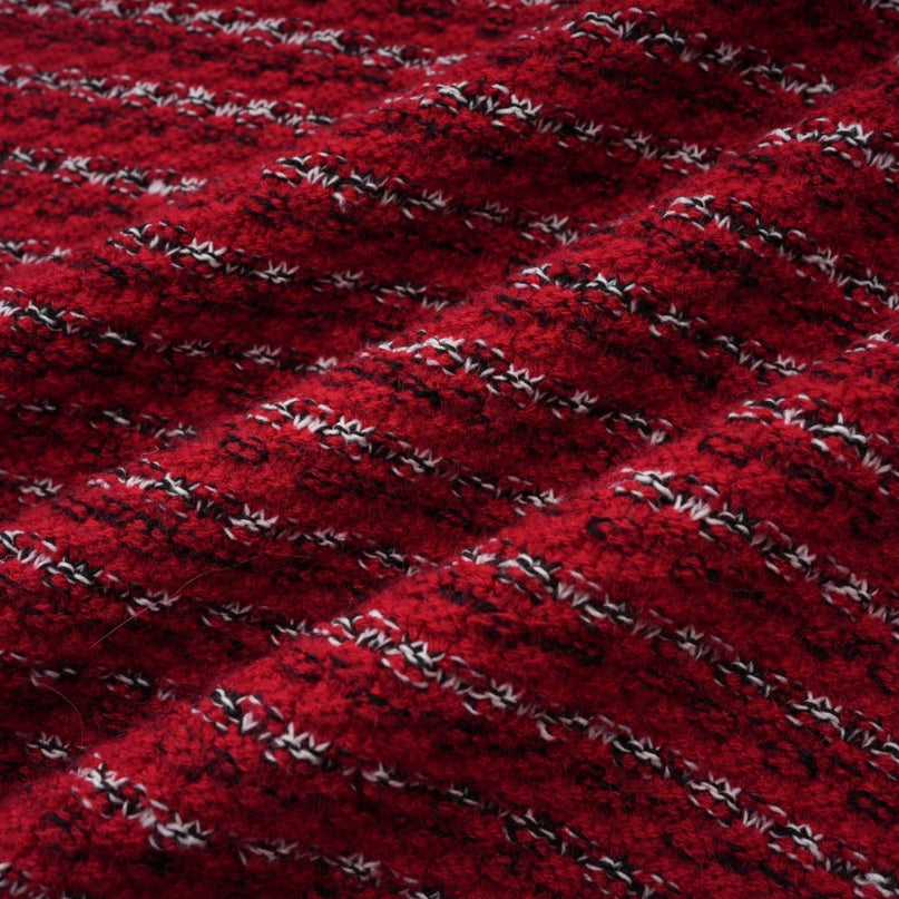 A short knit mini dress with a bow detail likely named Faustine