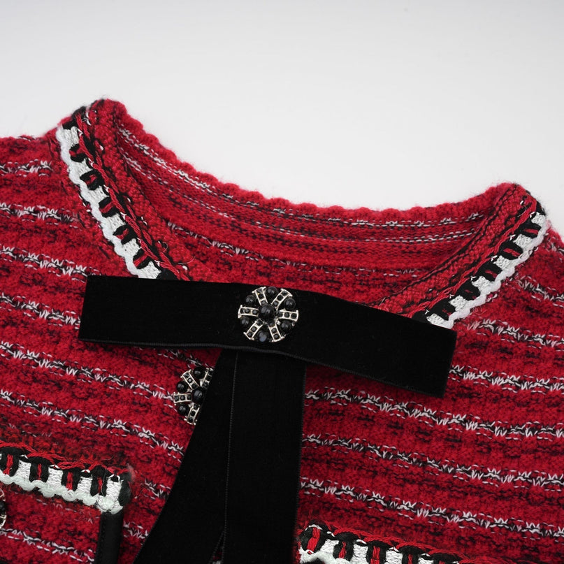 A short knit mini dress with a bow detail named Faustine