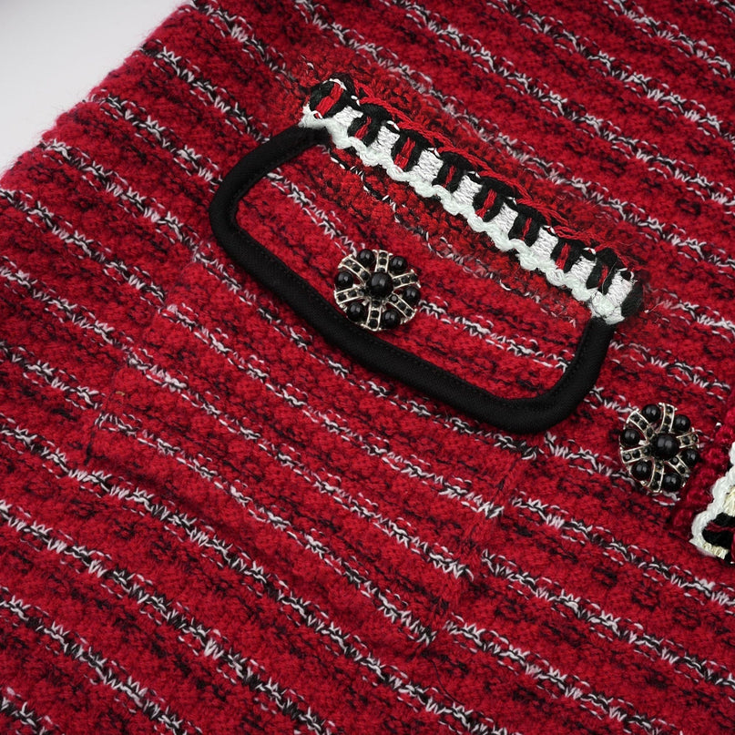 A short knitted dress with a bow detail and a mini length called Faustine