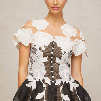 A short multicolored mini dress with floral embroidery and colorblocked design featuring the name Sandrine