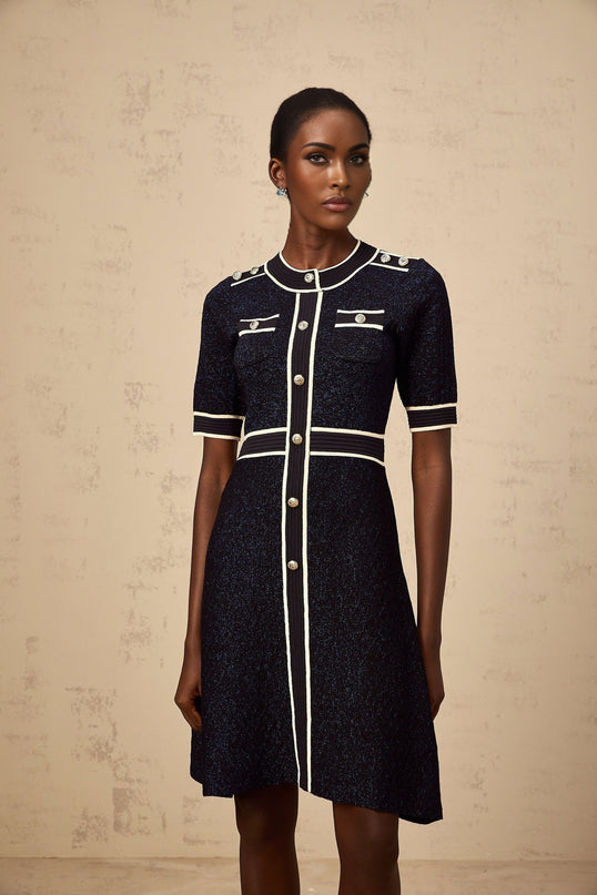 A short navy blue mini dress with glitter accents and a knit texture named Paulette