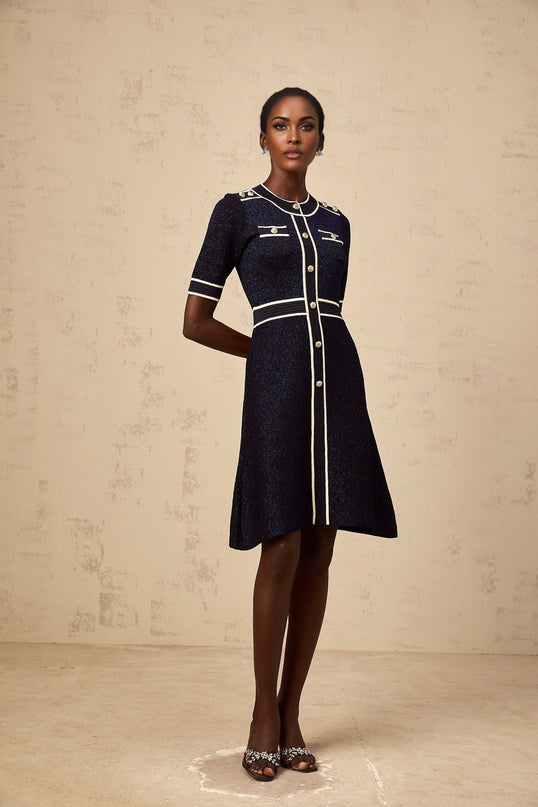 A short navy blue mini dress with glitter detailing and a knit texture named Paulette