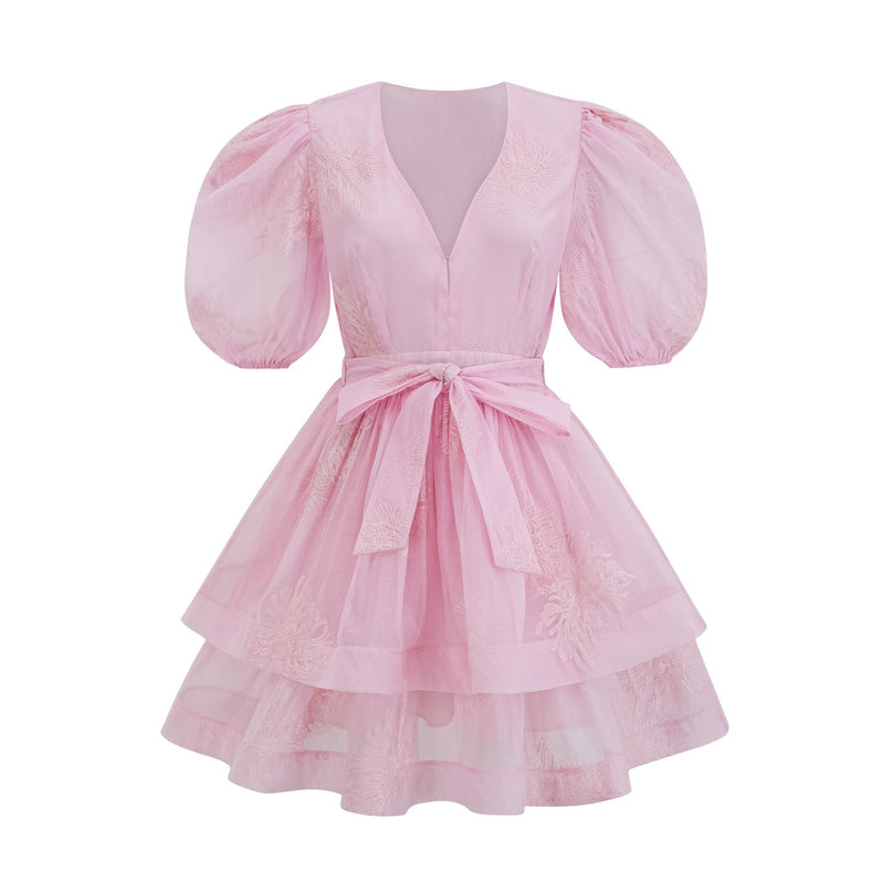 A short pink dress with floral embroidery and a layered skirt design named Florence